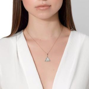 Rock + Raw Blue Topaz medium Guardian pendant.